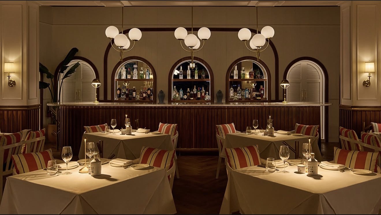Bagatelle Miami Run dining tables white linens champagne bucket outdoor terrace overlooking Miami River
