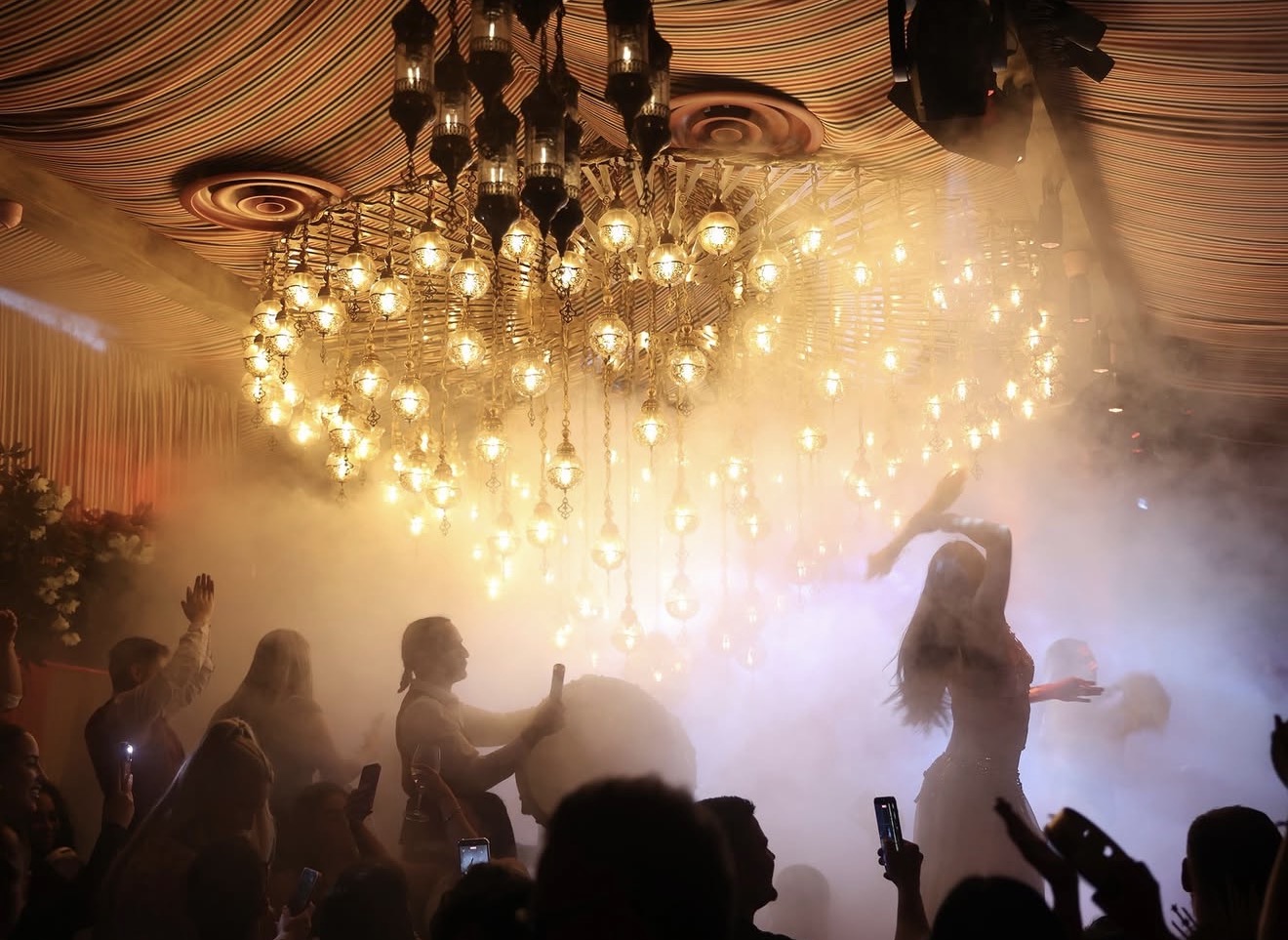 Habibi Miami River live entertainment smoke effects Moroccan lantern chandeliers dancer crowd Miami River restaurant