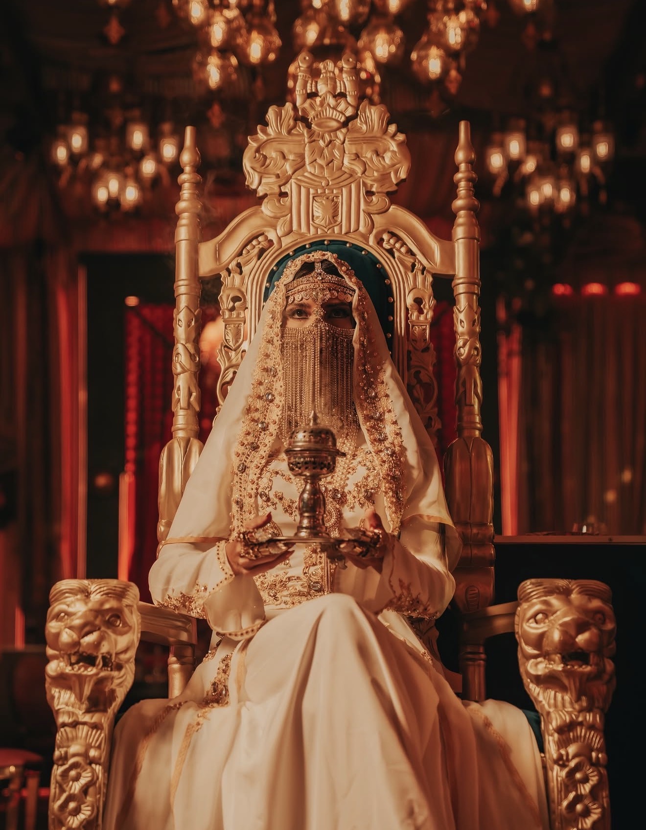 Habibi Miami River costumed performer gold throne Arabian headdress veil chandelier backdrop Miami River restaurant